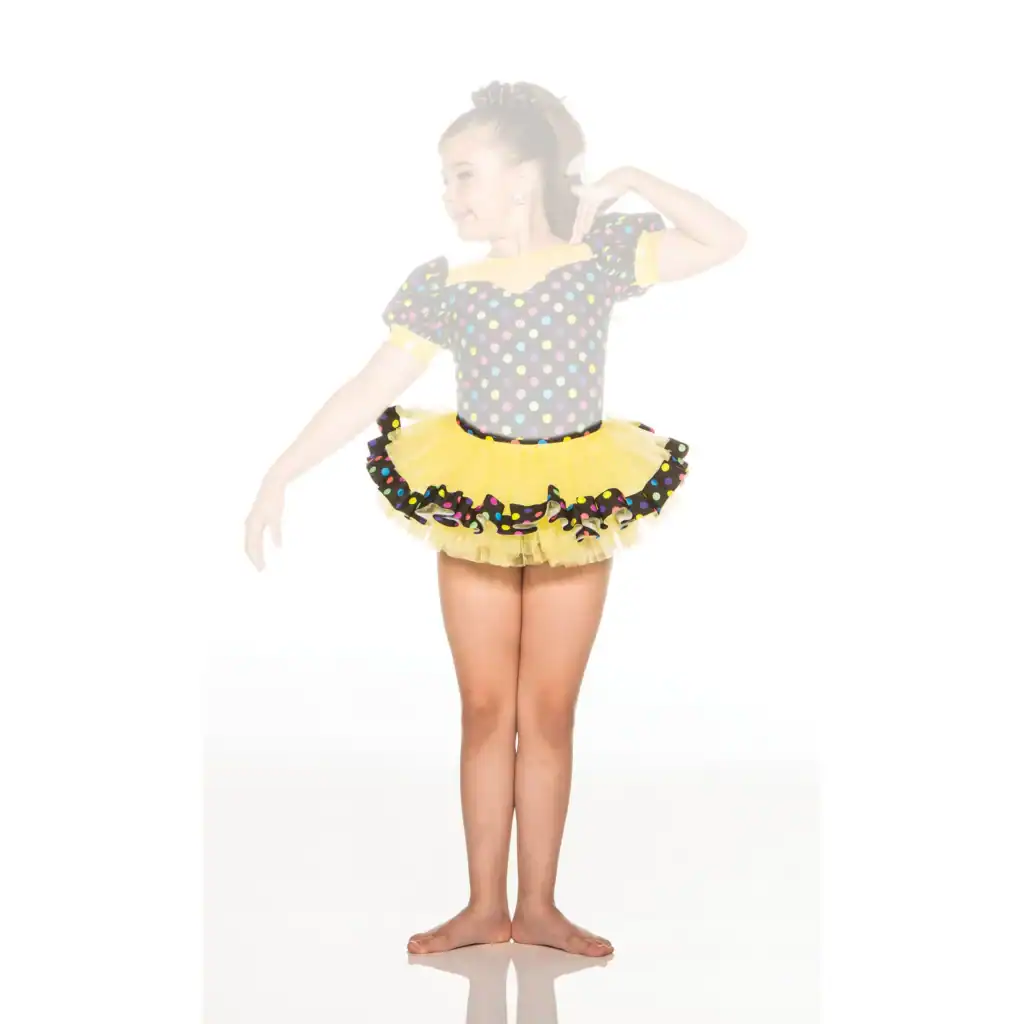 Young dancer in polka-dot leotard and yellow tutu