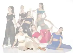 Nine women posing in colorful off-shoulder outfits