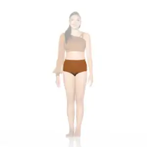Woman wearing brown asymmetrical crop top and high-waisted shorts