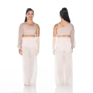 Model wearing blush one-shoulder crop top and wide-leg pants