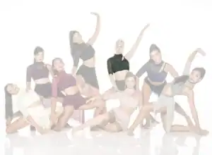 Eight young dancers posing in contemporary costumes on white background
