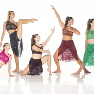 Five dancers posing in colorful lace costumes