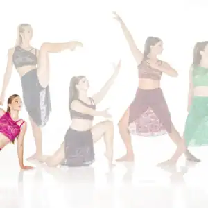 Five dancers pose in colorful lace dance costumes.