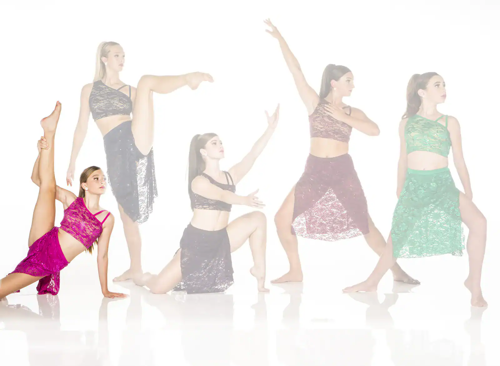 Five dancers pose in colorful lace dance costumes.