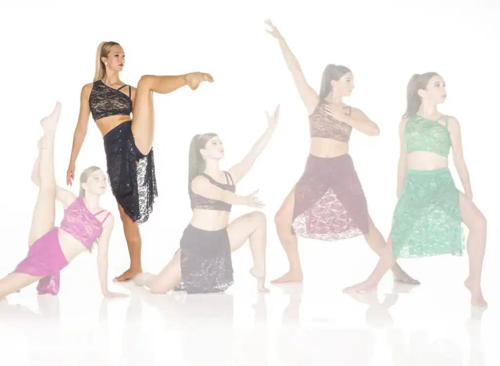 Five dancers in colorful lace costumes pose against white background.