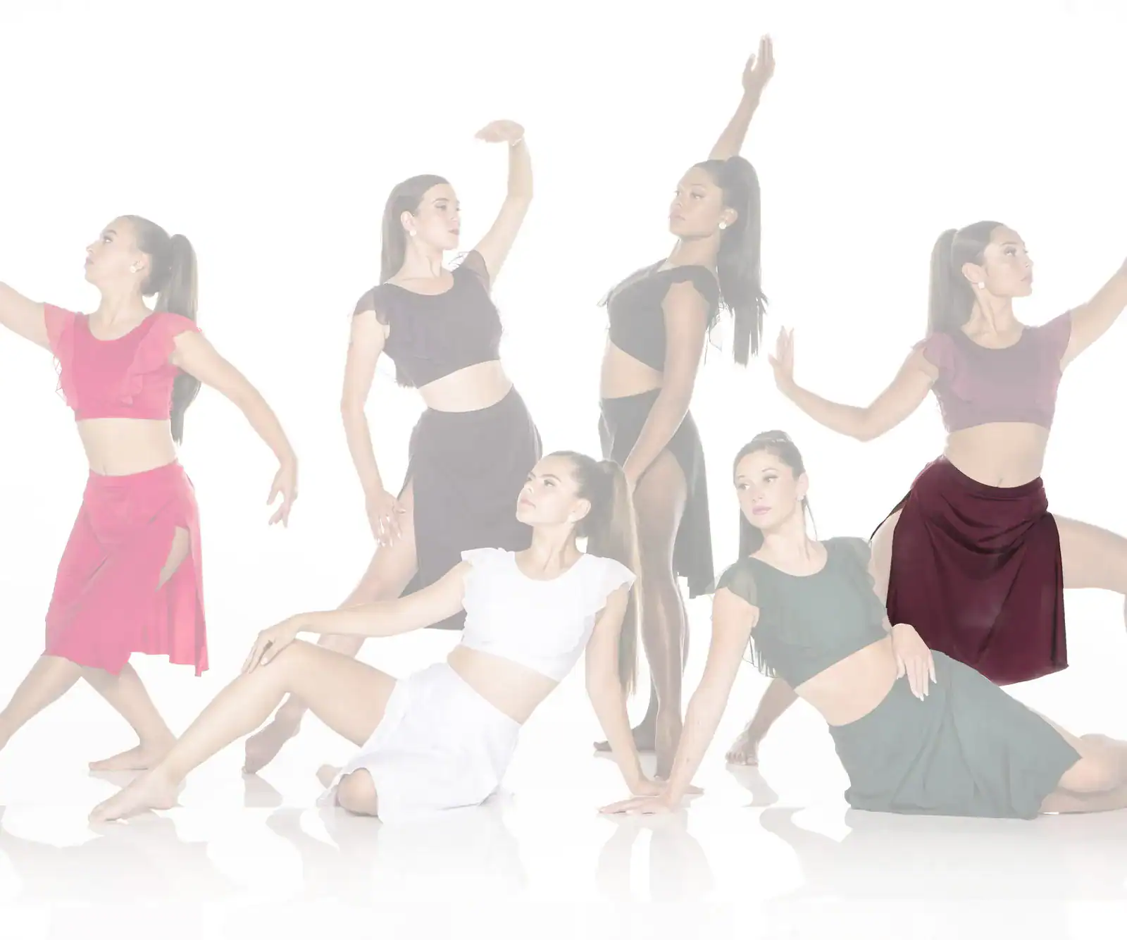 Six women dancers posing in colorful outfits