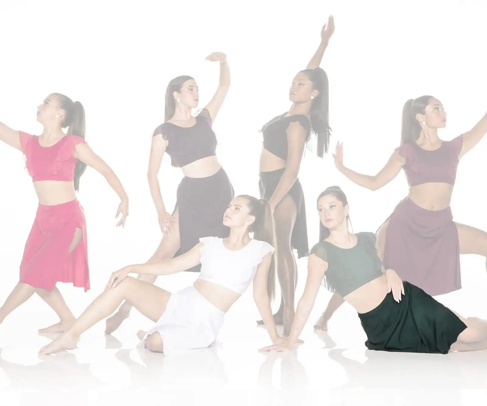 Six dancers posing in colorful costumes against a white background