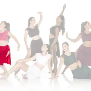 Six female dancers posing in colorful contemporary costumes