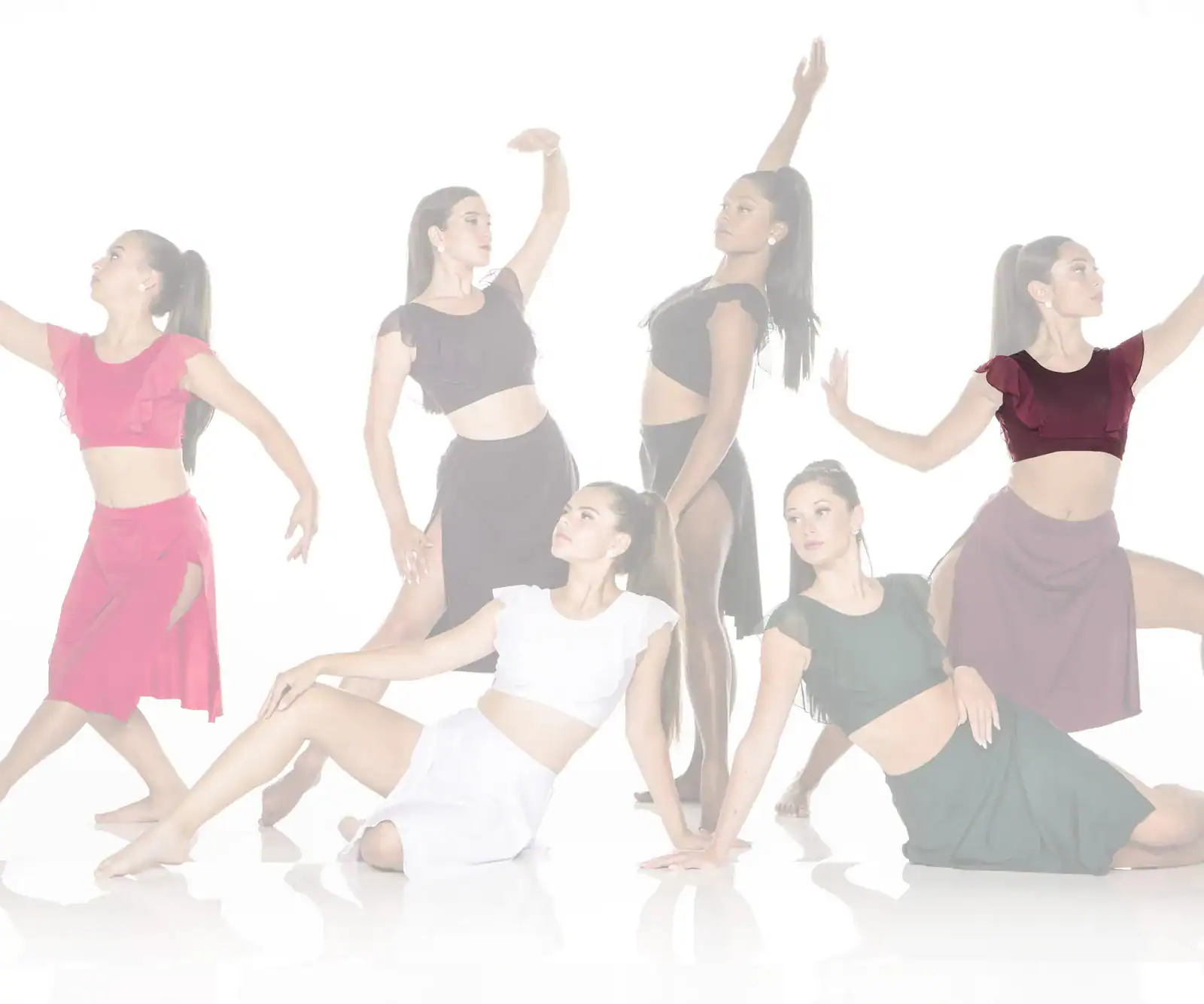 Six dancers pose in colorful outfits against a white background.