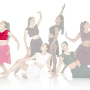 Six dancers posing in colorful outfits against a white background