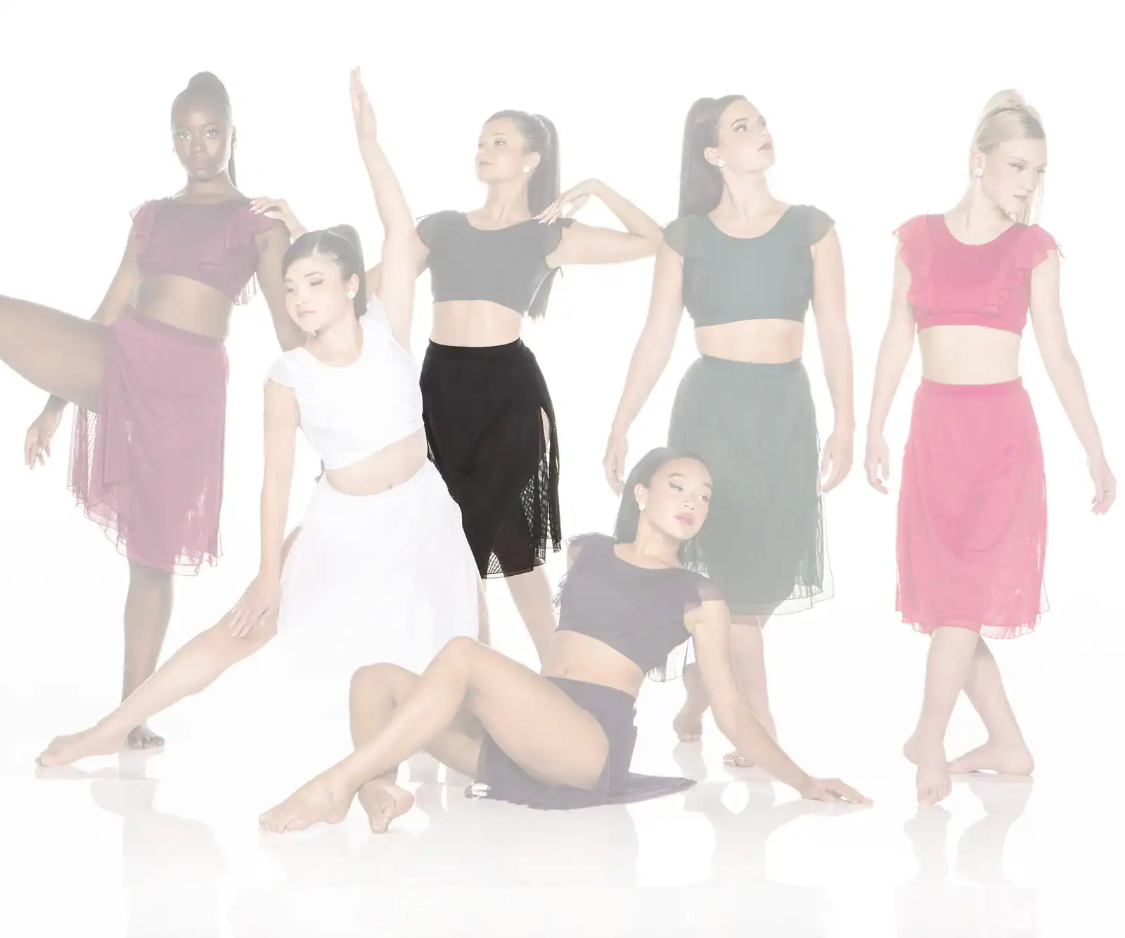 Six dancers pose in colorful two-piece costumes.