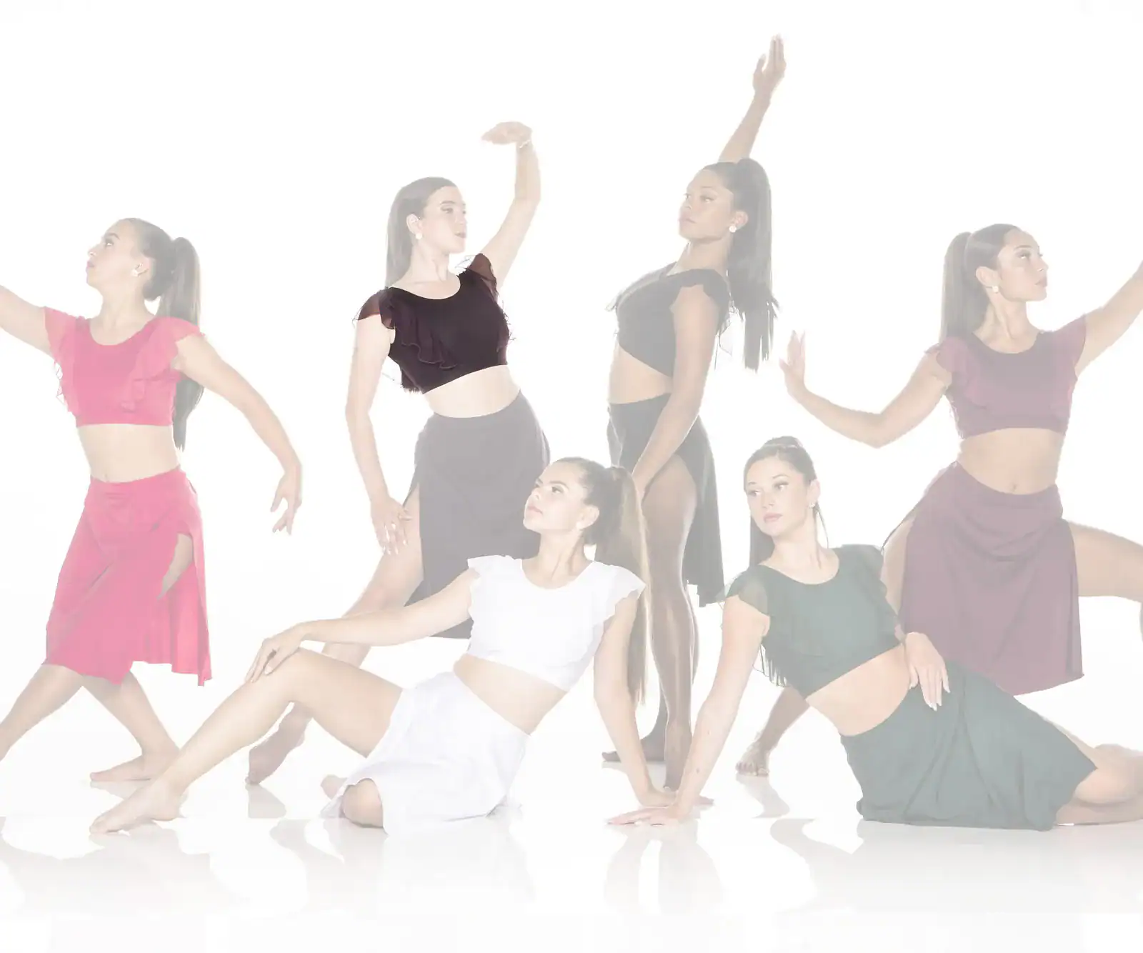 Six dancers posing in colorful costumes against white background
