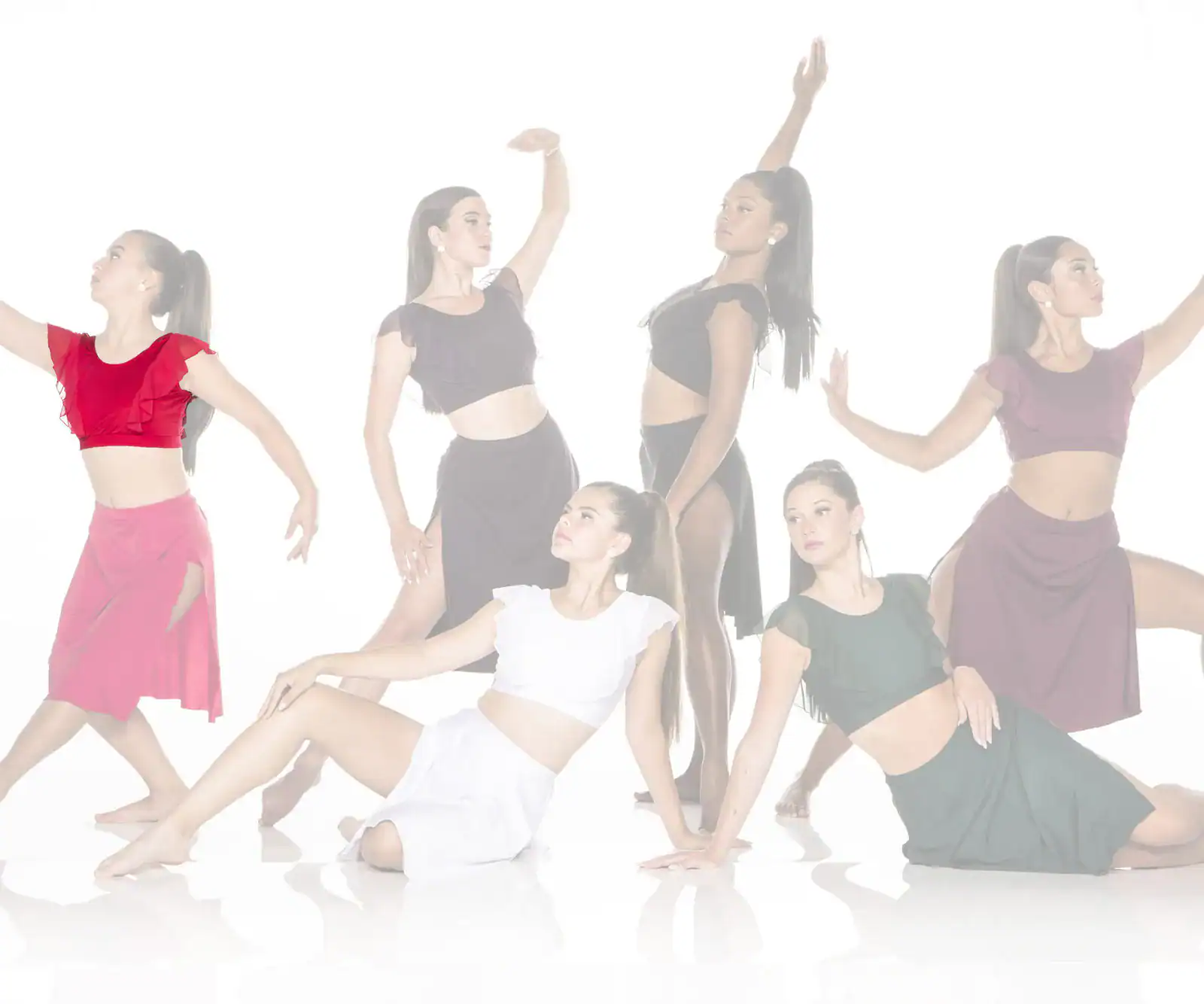 Six female dancers posing in colorful costumes against white background