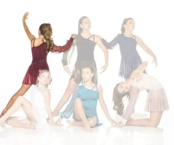 Six young dancers posing in colorful costumes against white background