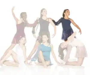 Six young dancers posing in colorful costumes against white background