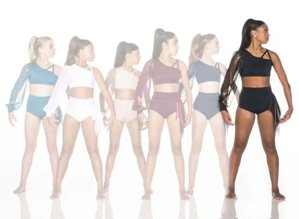 Six dancers modeling colorful asymmetrical dancewear against white background