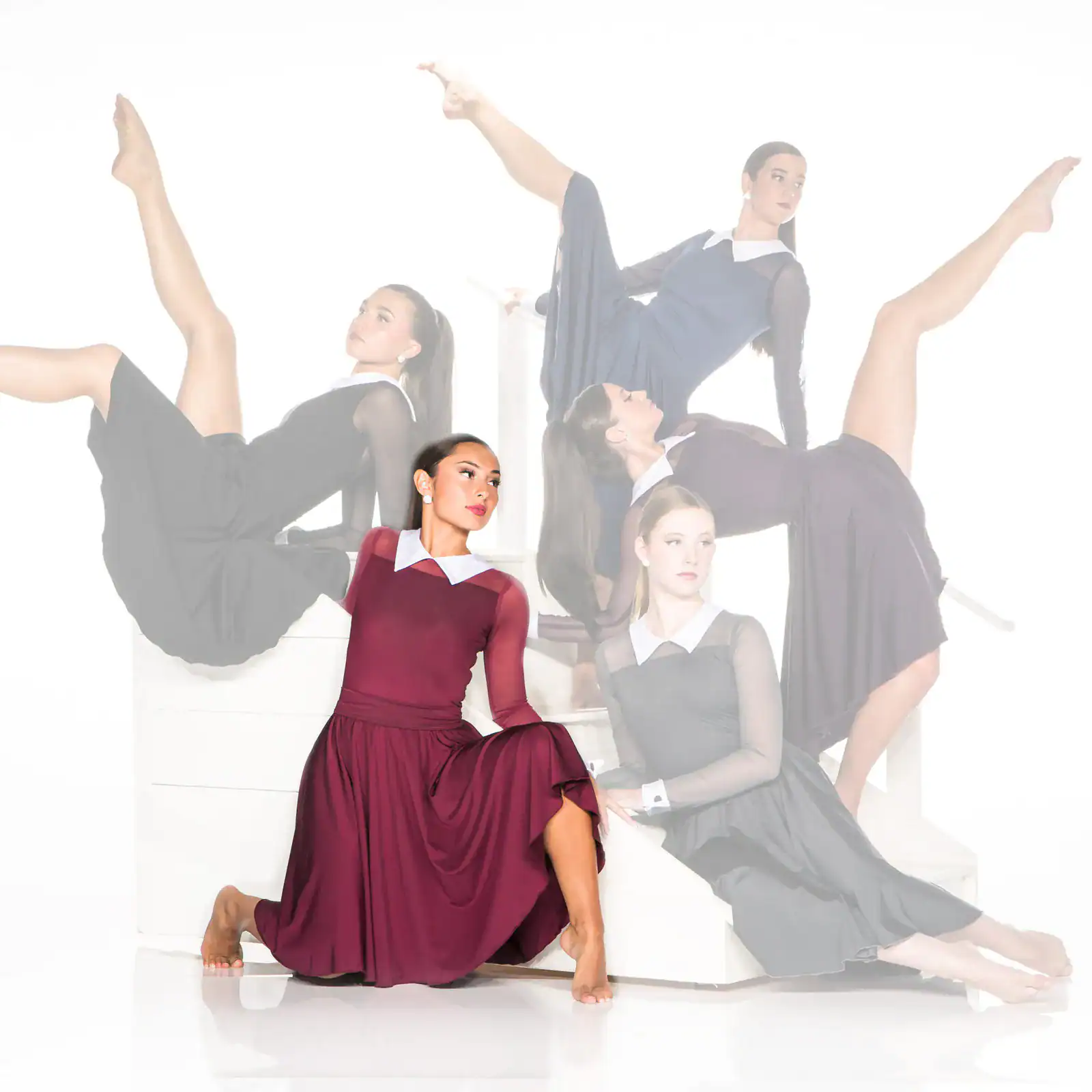 Dancers in elegant dresses pose against a white background.