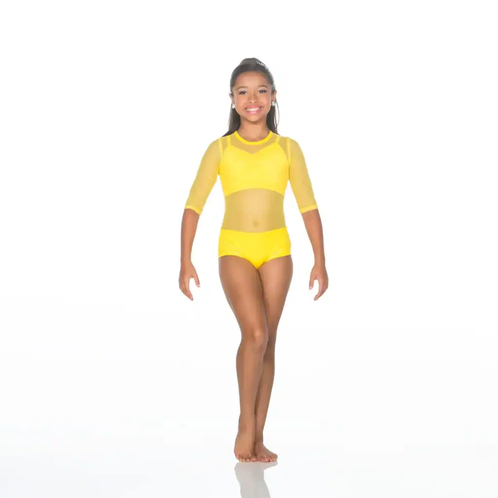 Smiling young dancer wearing a bright yellow dance costume