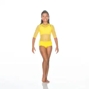 Smiling young dancer wearing a bright yellow dance costume