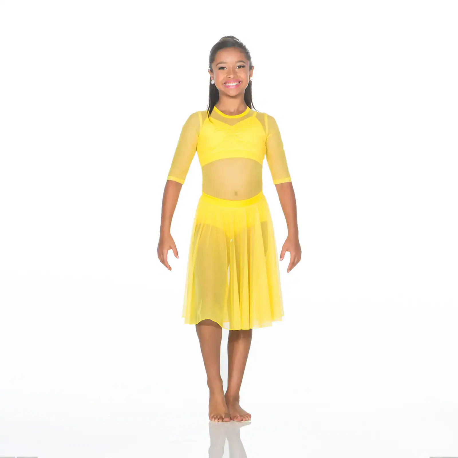 Smiling girl wearing a bright yellow dance costume
