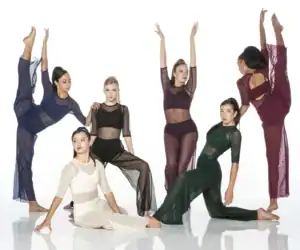 Six dancers posing in colorful sheer costumes on white background