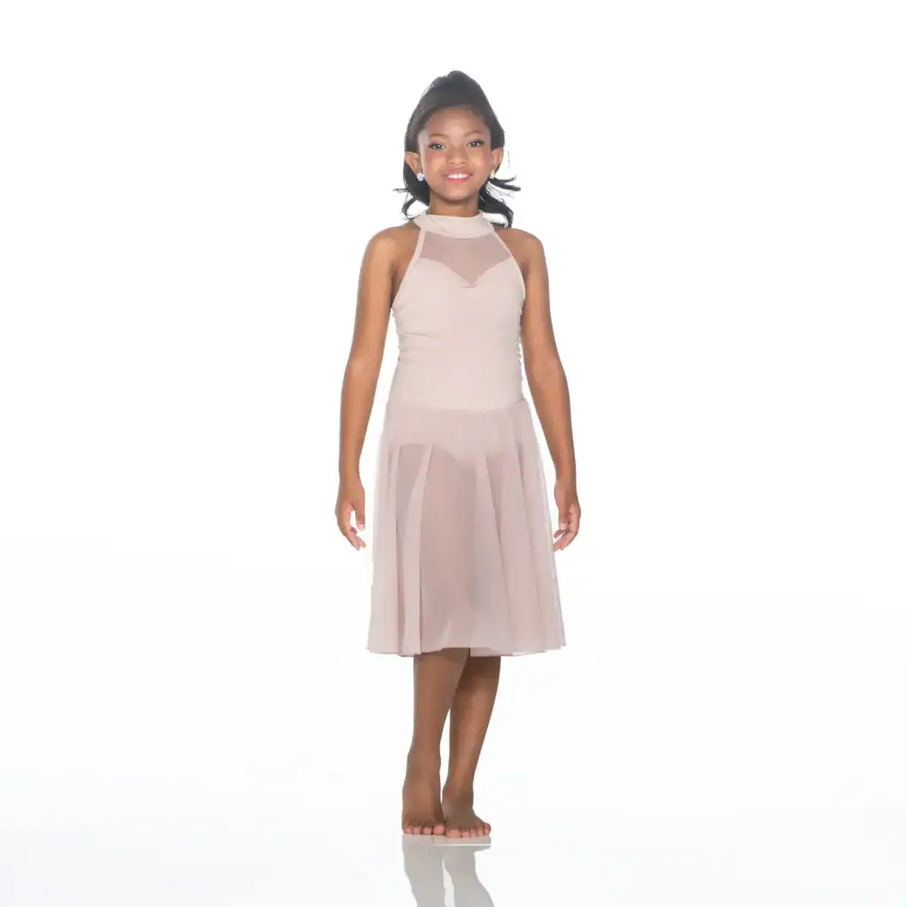 Girl wearing a blush pink sleeveless dress on white background