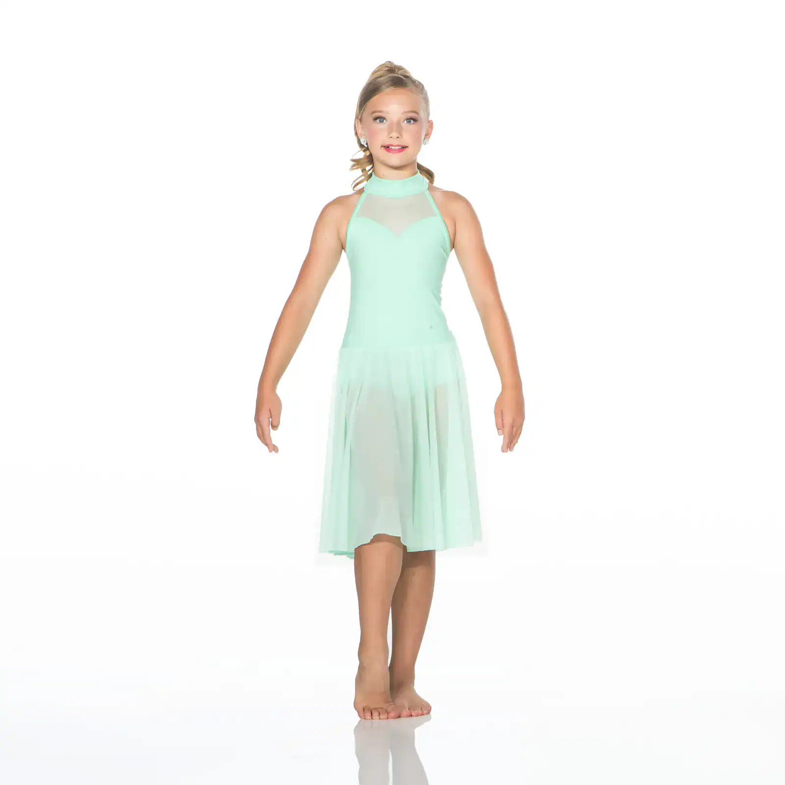 Young girl wearing a mint green dance dress