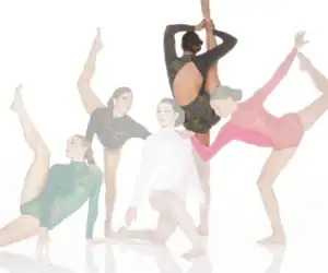 Five dancers pose in colorful leotards against white background.