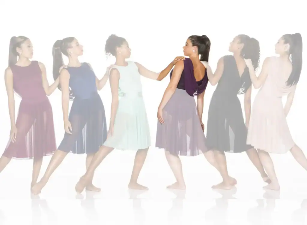 Six women in colorful dresses standing in a line