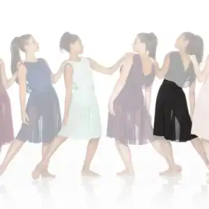 Six women wearing flowing dresses pose in a line