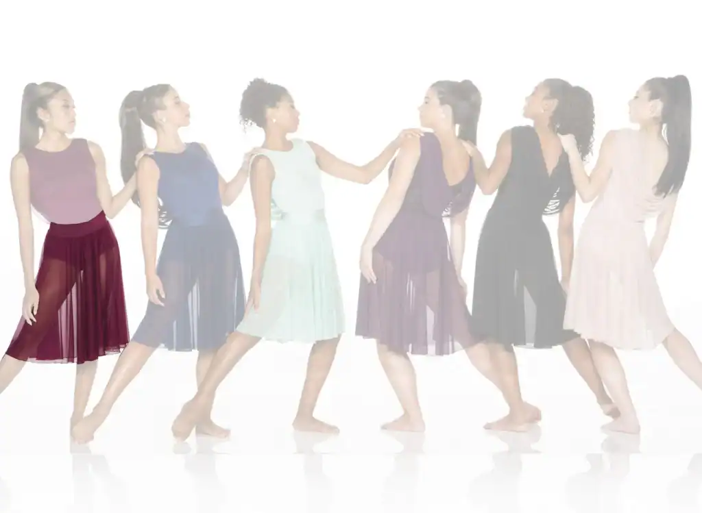 Six women wearing colorful flowing dance dresses in a line