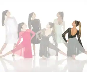 Women modeling flowing ballroom dance dresses