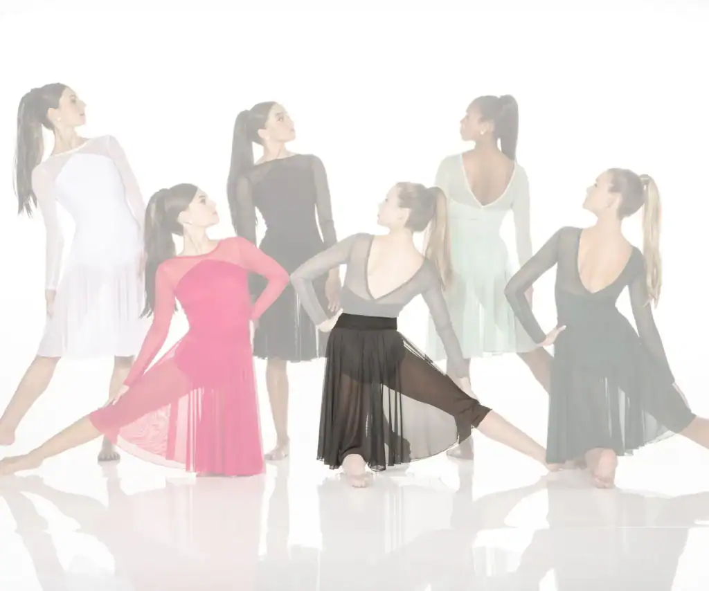 Six dancers modeling flowing performance dresses against white background