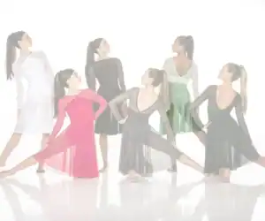 Six women model elegant ballroom dance dresses.