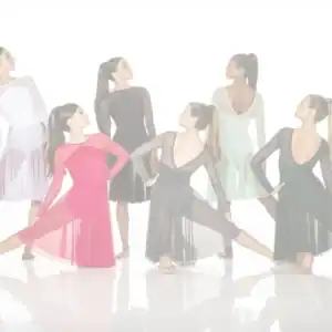 Six women pose in colorful ballroom dance dresses.
