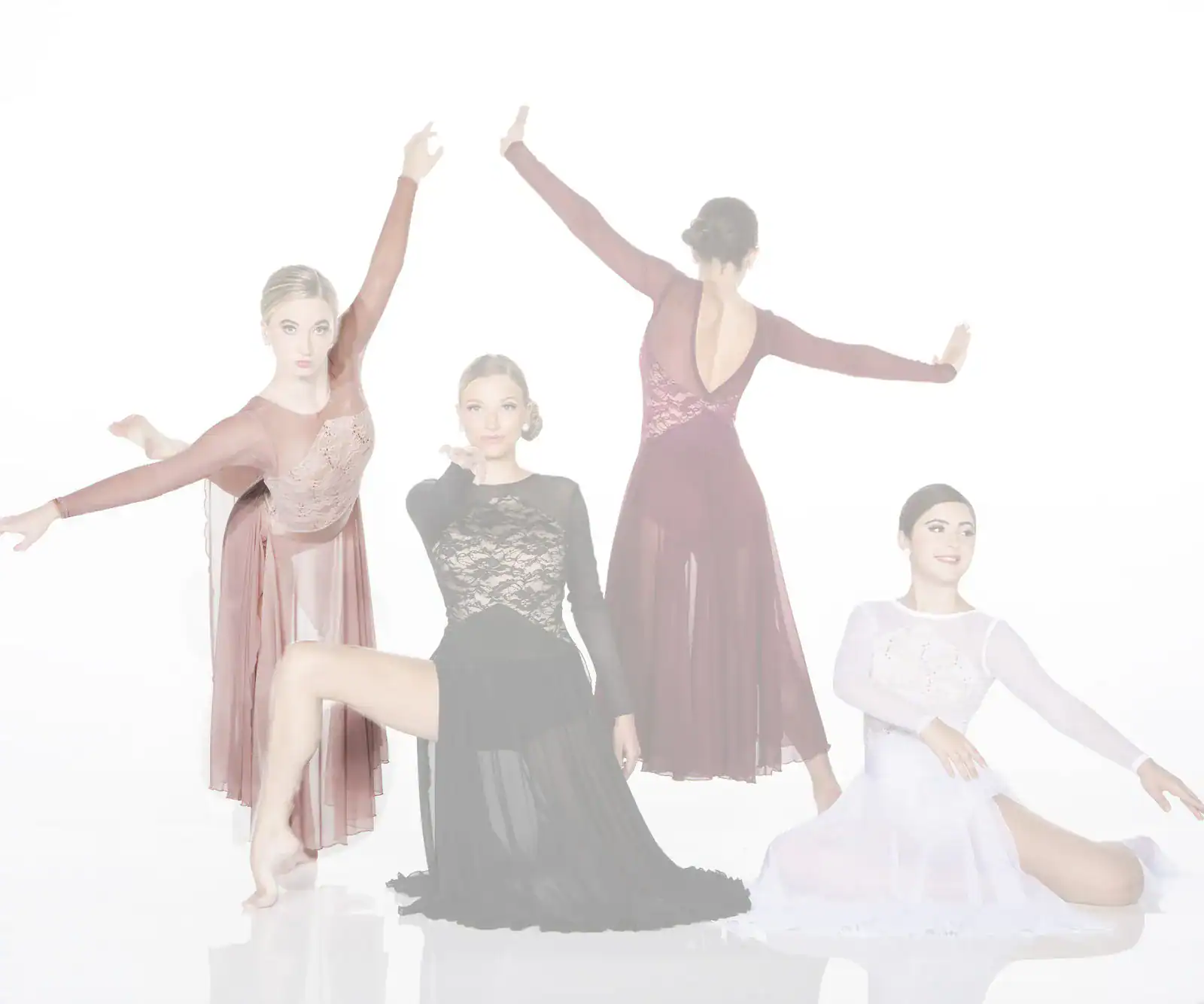 Four dancers pose in elegant flowing dresses
