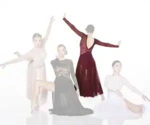 Four female dancers posing in elegant flowing dresses
