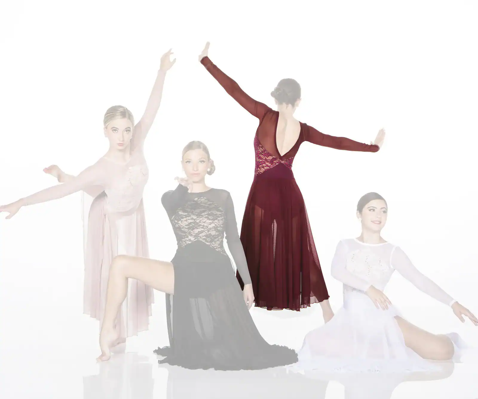 Four female dancers posing in elegant flowing dresses