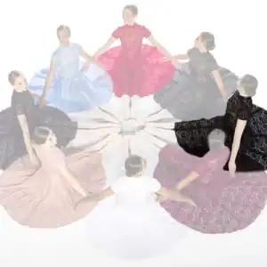Women in colorful lace dresses seated in a circle
