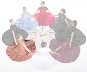 Women in colorful lace dresses seated in a circle