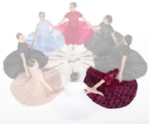 Women in lace gowns seated in a circle