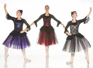 Three ballet dancers in colorful black lace dresses