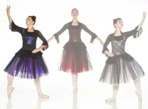 Three ballerinas pose in black lace dresses with colorful skirts.