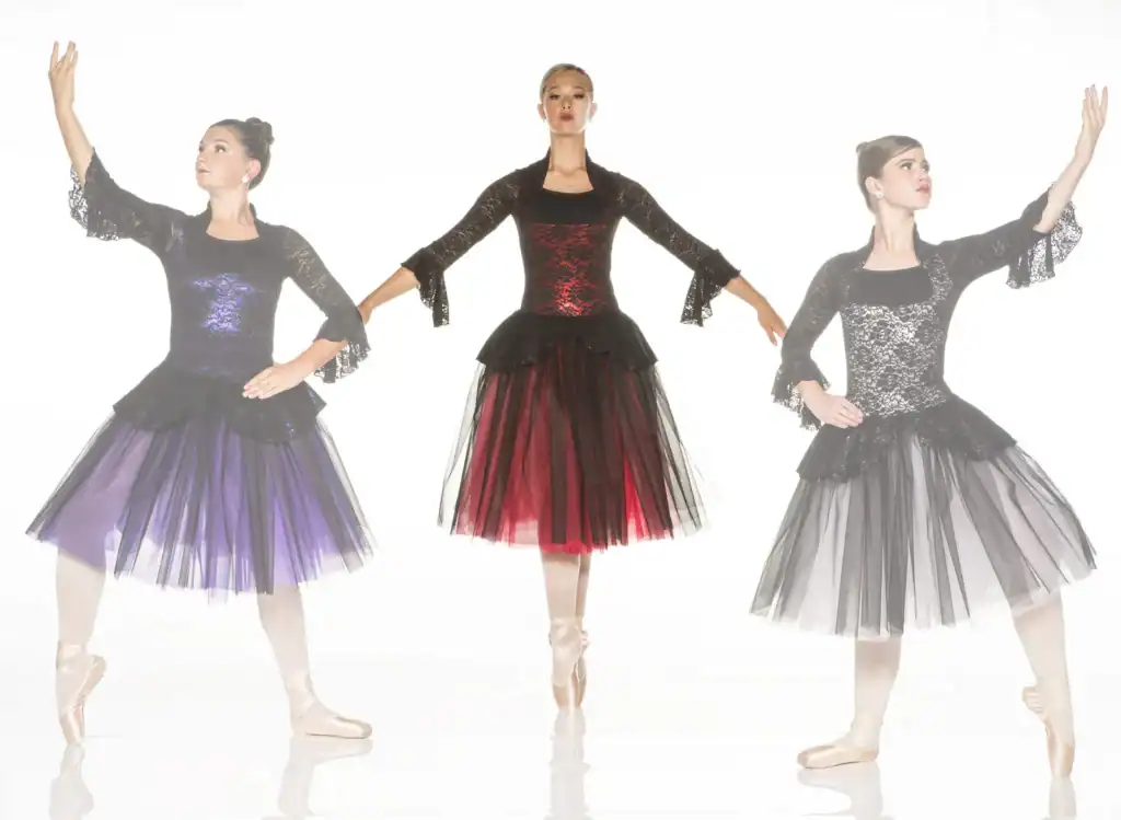 Three ballerinas in black lace dresses with colorful tulle skirts