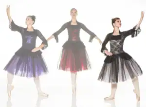 Three ballerinas modeling black lace dresses with colorful tulle skirts