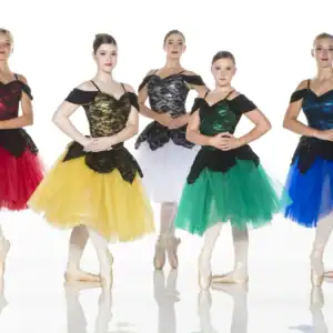 Five ballerinas in colorful tutus posing on pointe