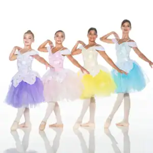 Four young ballet dancers in colorful tutus posing