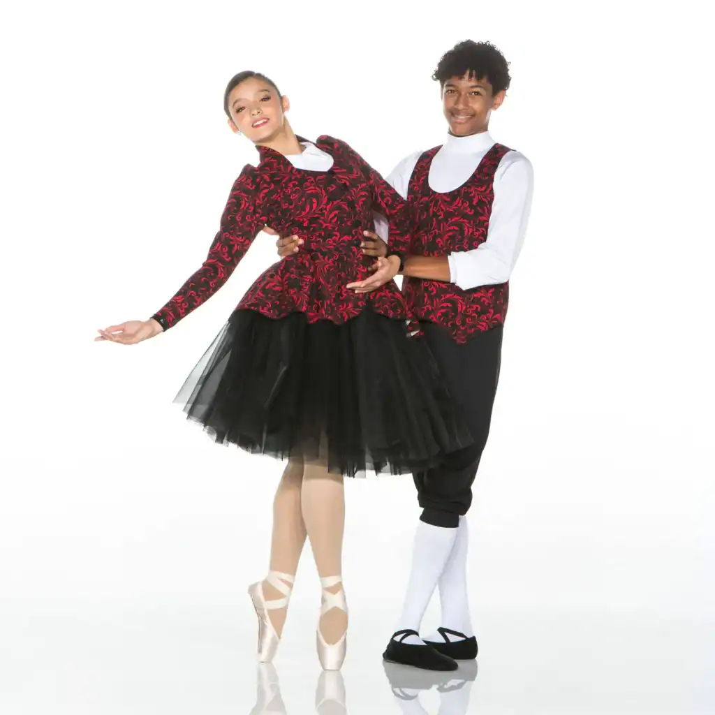 Two ballet dancers posing in matching red and black costumes