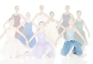 Young ballerinas in colorful tutus posing against white background