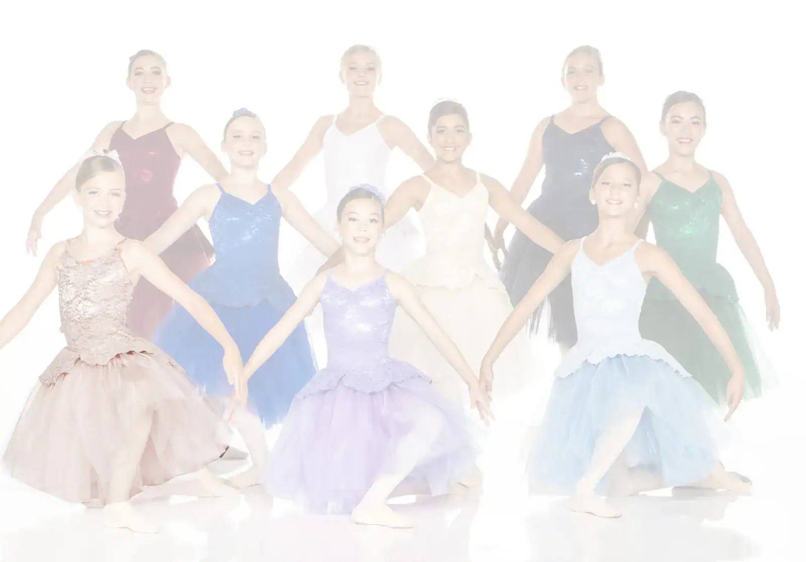 Young ballet dancers posing in colorful costumes